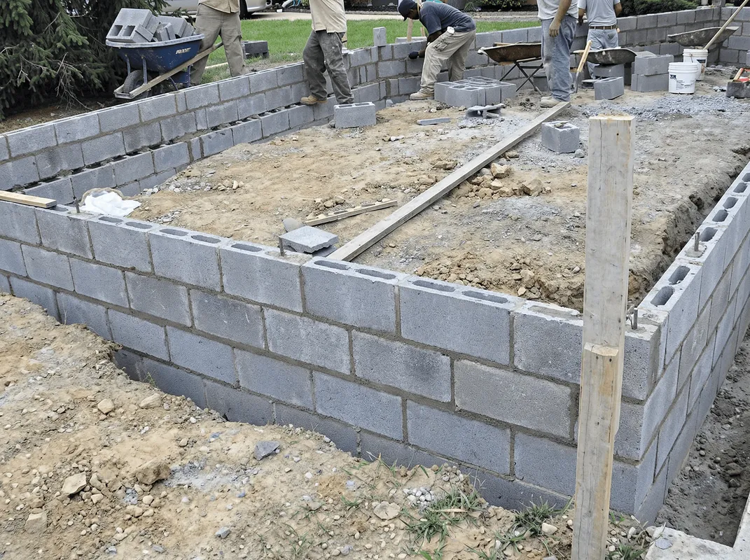 Professionals building a foundation with blocks in Bakersfield, CA